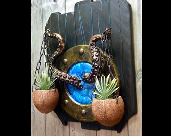 Nautical decoration/plaque. Portholes with tentacles and bowls with chains. Wood and resin.