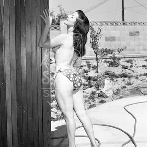 Nancy Lewis Topless in Vintage Bikini by Fence Looking Up - Reprint from Original Negative