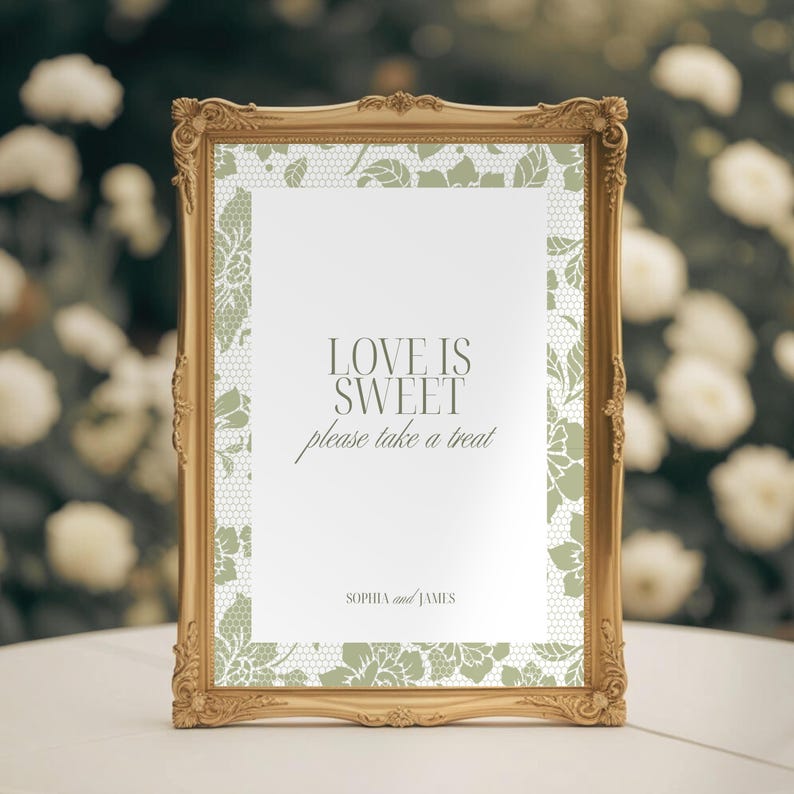 May include: A gold-framed sign with the text "LOVE IS SWEET please take a treat" in elegant script. The sign has a white background with a delicate green lace pattern border. The names "SOPHIA and JAMES" are at the bottom.