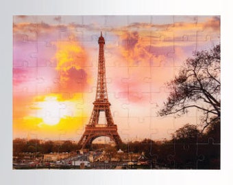 May include: A scenic view of the Eiffel Tower in Paris, France, at sunset. The tower is a prominent landmark in the city, and the sunset casts a warm glow over the scene. The sky is a mix of pink, orange, and purple, and there are clouds in the sky. There are trees in the foreground, and the city skyline is visible in the background.