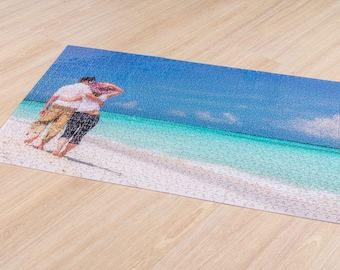 May include: A couple walk hand-in-hand on a white sandy beach with turquoise water and a blue sky.