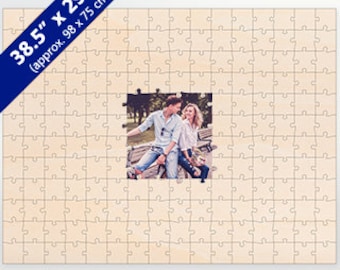May include: A custom photo jigsaw puzzle with a light wood finish. The puzzle measures 38.5 inches by 29.5 inches, or approximately 98 centimetres by 75 centimetres. The puzzle features a photo of a couple sitting on a bench in a park.