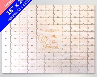 May include: A wooden jigsaw guest book with a personalised message that reads "Mr. and Mrs. Edwards" in gold lettering. The jigsaw is 18 inches by 24 inches and has a light wood finish.