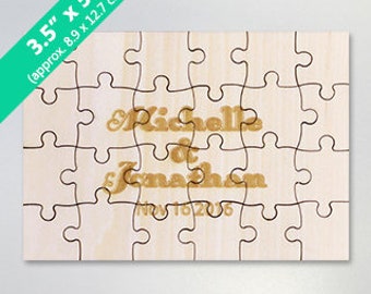 May include: A wooden jigsaw puzzle with 20 pieces, measuring 8.9 cm by 12.7 cm. The puzzle is engraved with the names "Michelle & Jonathan" and the date "Nov 16 2026".