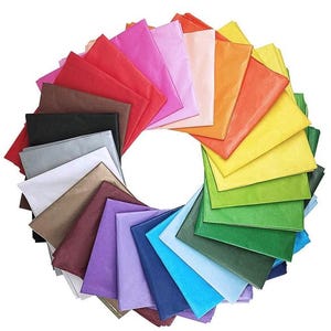 May include: A pack of 24 tissue paper sheets in a rainbow of colours, including red, orange, yellow, green, blue, purple, brown, black, and white. The tissue paper is arranged in a circle, with each sheet overlapping the next.