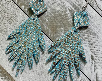 Blue and silver starburst leather earrings
