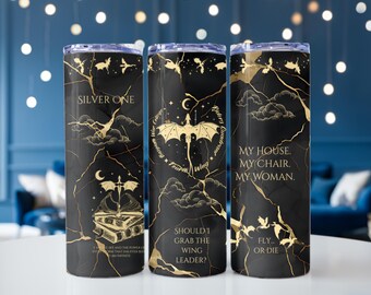 May include: Three black and gold insulated tumblers with various quotes and dragon illustrations. The tumblers feature the phrases "Silver One", "My House. My Chair. My Woman.", and "Fly or Die". The design includes gold accents and a marble-like texture.
