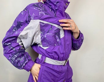 purple ski suit