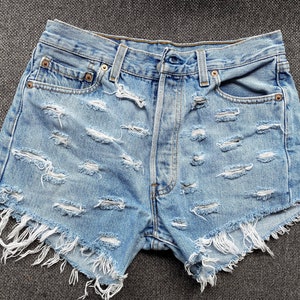 Levis woman’s shorts, sexy bottoms, distressed denim W30 L34