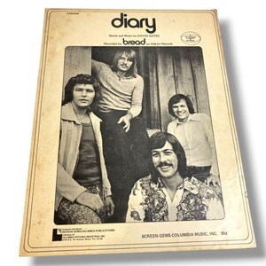 May include: A vintage sheet music cover for the song Diary by David Gates, recorded by the band Bread. The cover features a black and white photograph of the four band members, with the title and credits printed in black text on a cream background.
