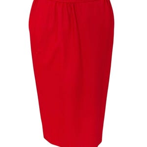 May include: A bright red skirt with a straight, fitted silhouette. The skirt has a simple design with a smooth, even texture.