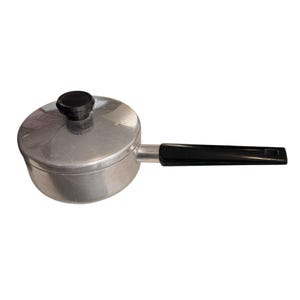May include: A small, silver saucepan with a lid and a black handle. The lid has a black knob. The saucepan is designed for cooking and has a long handle for easy use. The pan is made of metal.