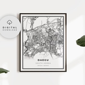 May include: Black and white city map print of Daegu, South Korea. The map shows the city streets and landmarks. The text "Daegu, South Korea" and "35°52'N | 128°36'E" is printed below the map.