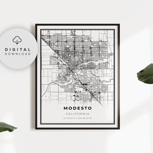 May include: Black and white line art map of Modesto, California. The map shows the city streets and includes the city name and coordinates: 37°39'41"N | 120°59'40"W.