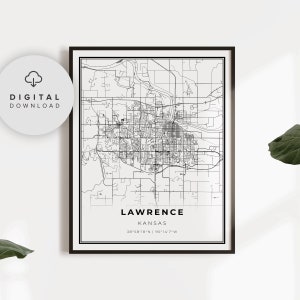 May include: Black and white line art map of Lawrence, Kansas. The map shows the city streets and major landmarks. The text "LAWRENCE KANSAS 38°58'18"N | 95°14'7"W" is at the bottom of the map.