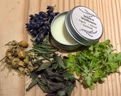 Headache and migraine balm remedy with feverfew, rosemary, peppermint, chamomile and lavender oil - vegan, natural, organic.