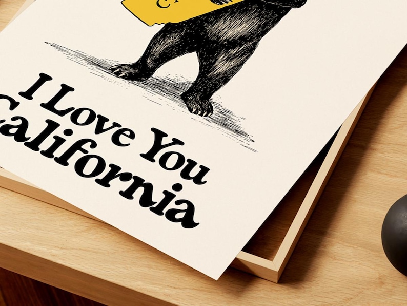 May include: A black and white illustration of a bear holding a yellow outline of the state of California. The text "I Love You California" is written in black below the bear.