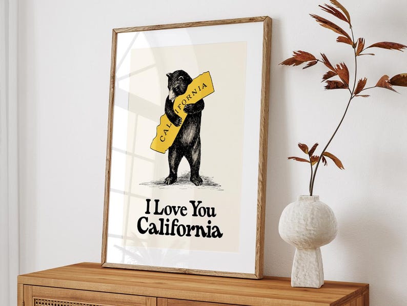 May include: A black bear hugging a yellow outline of the state of California with the text "CALIFORNIA" on it. The text "I Love You California" is below the bear.