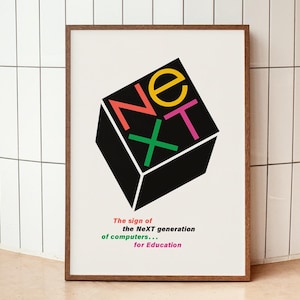 May include: A framed art print displaying a black cube with the word "NeXT" in vibrant colours. The text below states "The sign of the NeXT generation of computers... for Education". The print is in a wooden frame.