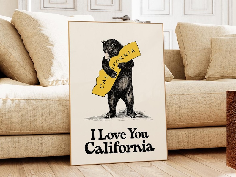 May include: A black bear hugging a yellow outline of the state of California. The bear is standing on a white background. The text "I Love You California" is printed below the bear.