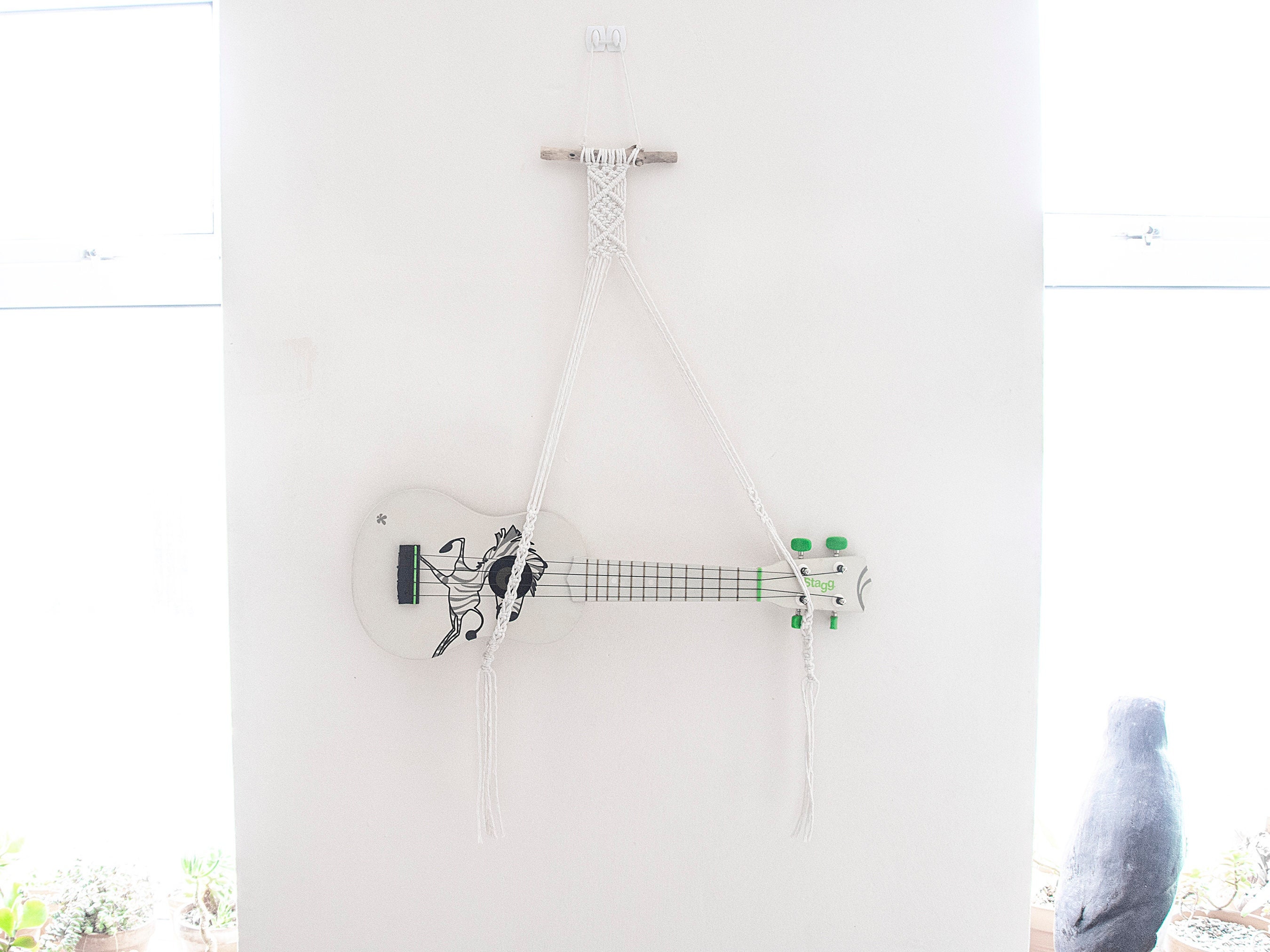 white ukulele wall mount