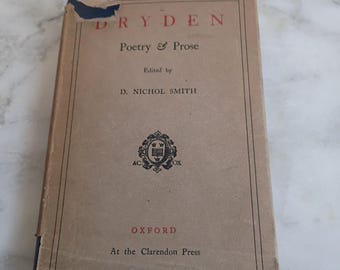 May include: A well-worn copy of "DRYDEN Poetry & Prose", edited by D. Nichol Smith and published by Oxford at the Clarendon Press. The book's cover is tan with red and black text, and features a decorative emblem. The cover shows some damage.