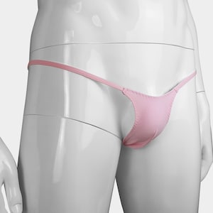 May include: Pink thong underwear with a low rise and a thin strap design.