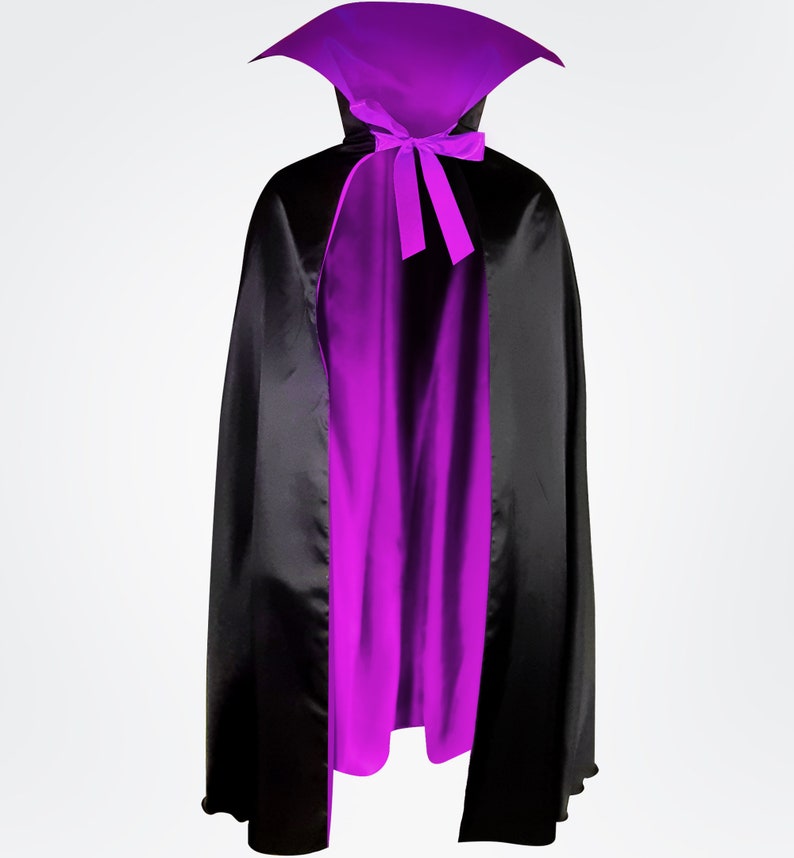 May include: A black and purple satin cape with a high collar and a bow tie. The cape is lined with purple satin.