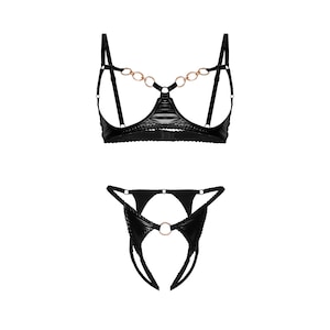 May include: Black lingerie set with a chain detail on the bra and a ring detail on the panty.