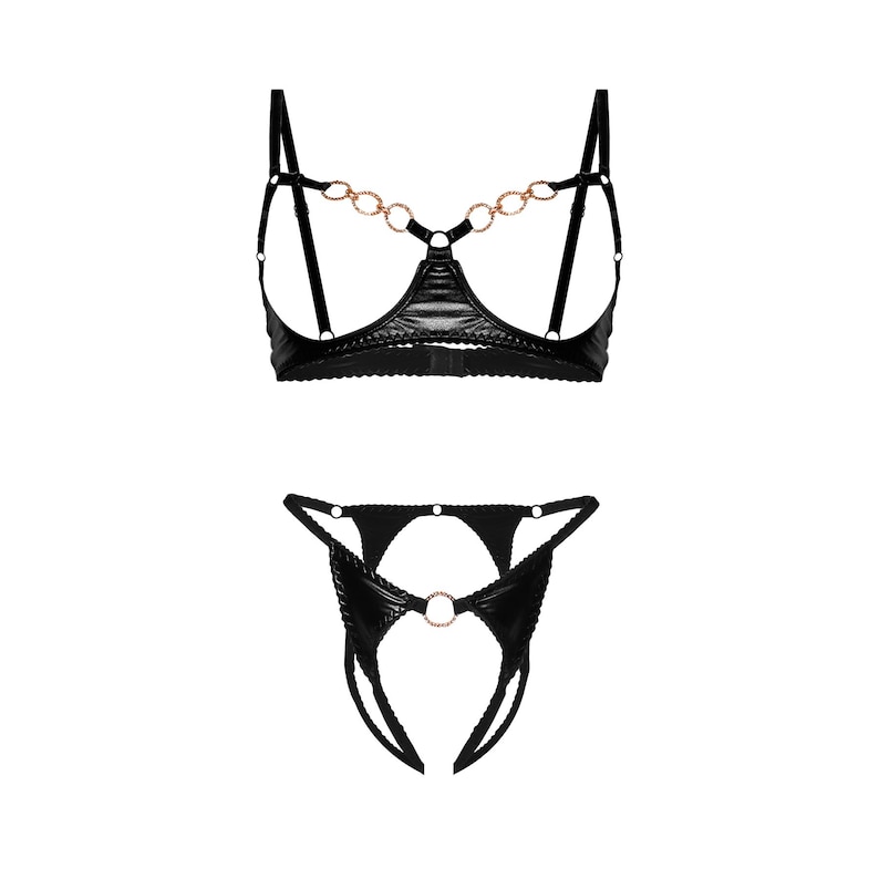 May include: Black lingerie set with a chain detail on the bra and a ring detail on the panty.
