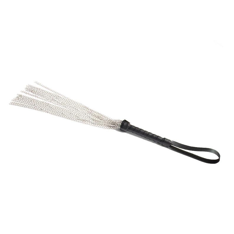 May include: A black leather-wrapped whip with a silver chain tassel.