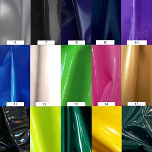 May include: A swatch card with 25 different colors of vinyl fabric. The colors include orange, pink, red, purple, gray, black, blue, green, yellow, and white.