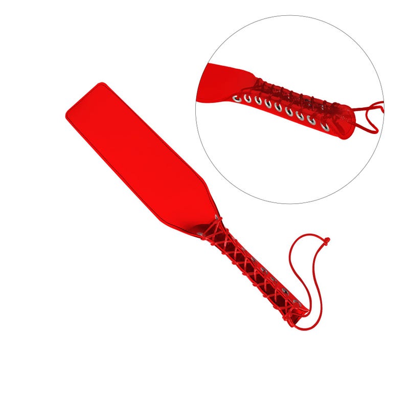 May include: A red leather paddle with a red and white braided handle. The handle is tied with a white cord.