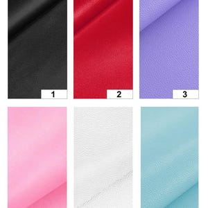 May include: A collection of six fabric swatches in various colors. The swatches include black, red, lavender, pink, white, and light blue. Each swatch has a slightly textured surface and is numbered from 1 to 6.