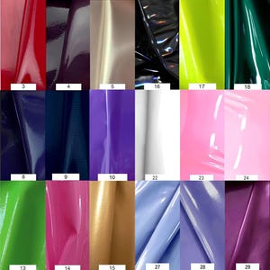 May include: A swatch card with 30 different colors of vinyl fabric. The colors include orange, pink, red, purple, beige, black, gray, blue, green, yellow, and white.