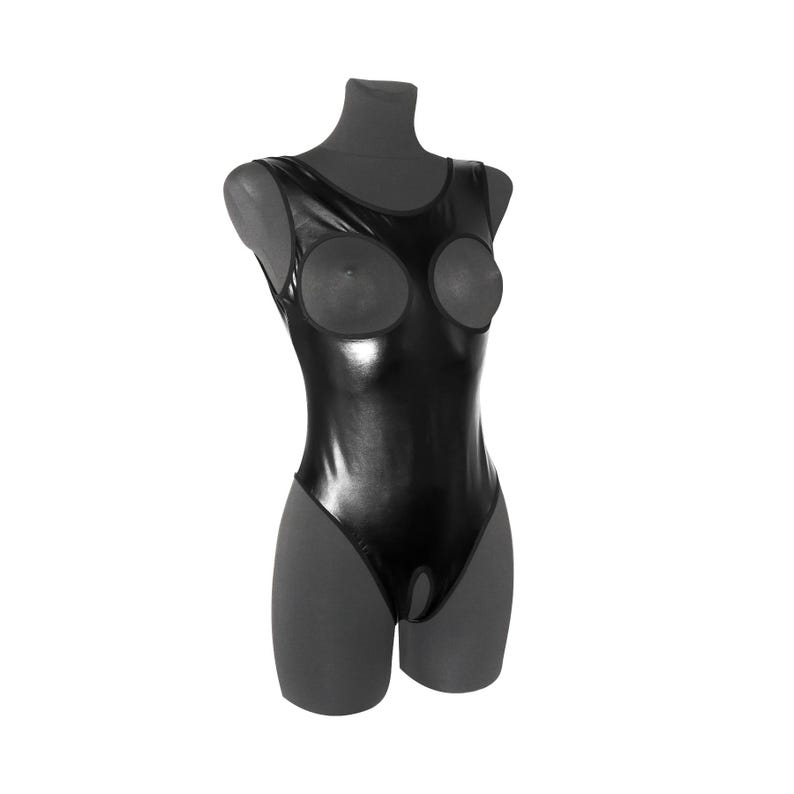 May include: Black shiny bodysuit with a plunging neckline and cutouts at the bust. The bodysuit has a snap closure at the crotch.