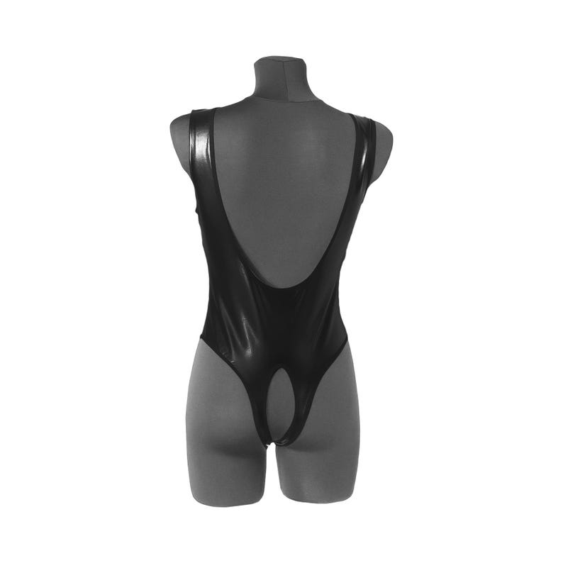 May include: Black bodysuit with a plunging back and a cutout in the back.