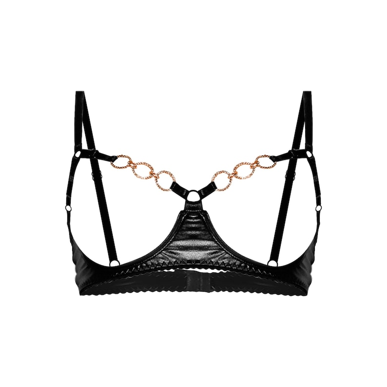 May include: Black lingerie bra with a gold chain detail. The bra has a plunging neckline and adjustable straps.