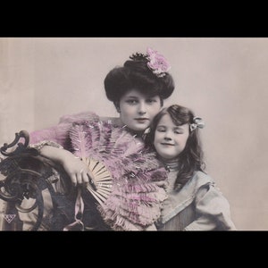 Vintage postcard of a beautiful Edwardian woman with her daughter