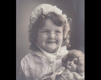 Vintage postcard ∙ Adorable little girl posing with her big doll