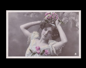 Vintage postcard of a romantic Edwardian woman