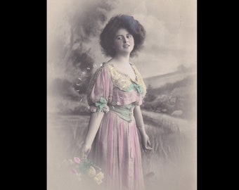 Vintage postcard of a romantic Edwardian woman