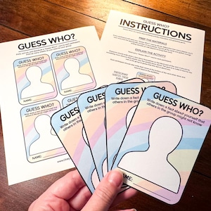 May include: A "Guess Who?" game set with printed cards and instructions. The cards feature a silhouette and space for names, with pastel rainbow accents. The instructions are printed on a separate sheet.