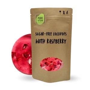 May include: A brown paper bag of sugar-free raspberry lollipops. The bag has a clear window showing the candy and the text "Sugar-free Lollipops with Raspberry". A single red lollipop is next to the bag.