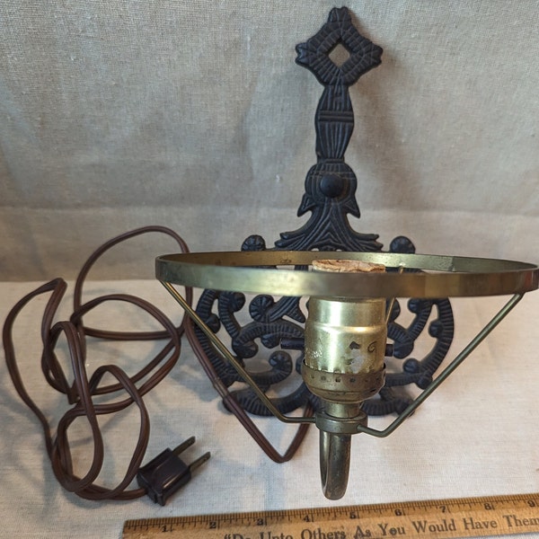 Vintage Primitive style cast iron wall light. Ornate Rustic Farmhouse.