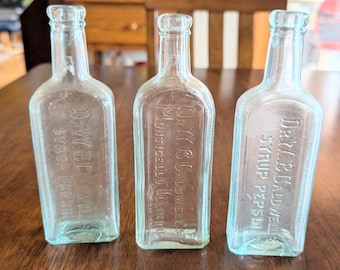 Lot of 3 Vintage 7" tall glass medicine bottles. Dr. W.B. Caldwell syrups Monticello, Illinois