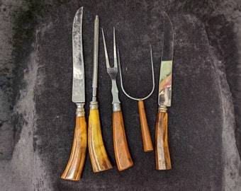 Meat Carving Set; a Fork, 2 Knives, a Lifting Fork, and a Knife Sharpener