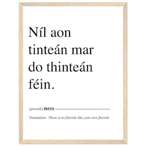May include: Black and white typography print with the Irish proverb "Níl aon tinteán mar do thinteán féin." which translates to "There is no fireside like your own fireside."