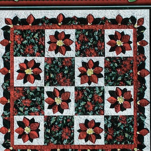 May include: A quilting pattern for a Poinsettia quilt, designed by Ruth Jensen. The pattern is foundation pieced and features a red and green color scheme. The pattern is titled "Poinsettia" and includes the text "Foundation Pieced" and "Thimble Art".