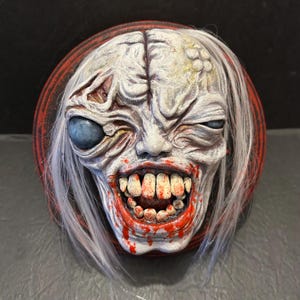 Resident Evil: Requiem The Girl monster hanging head sculpt decoration